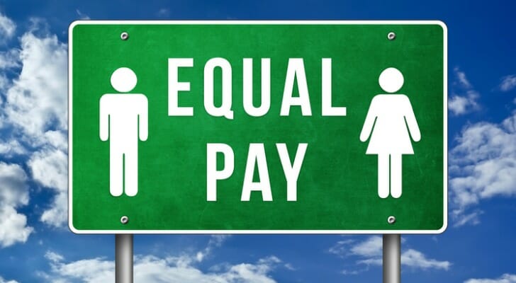 An "EQUAL PAY" sign