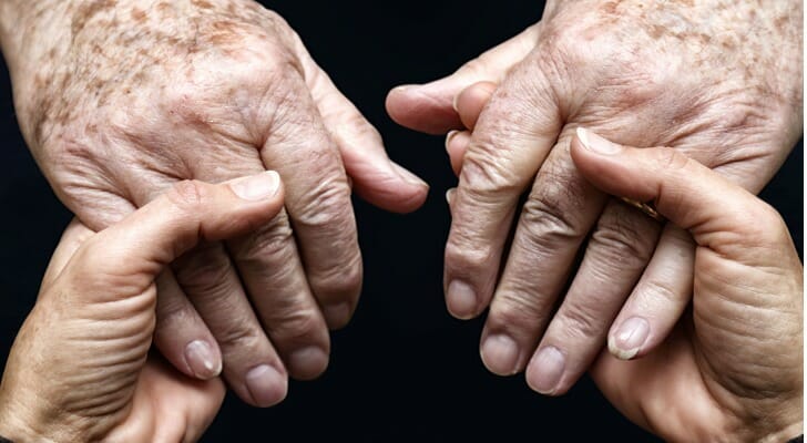A pair of hands seen holding another pair of hands