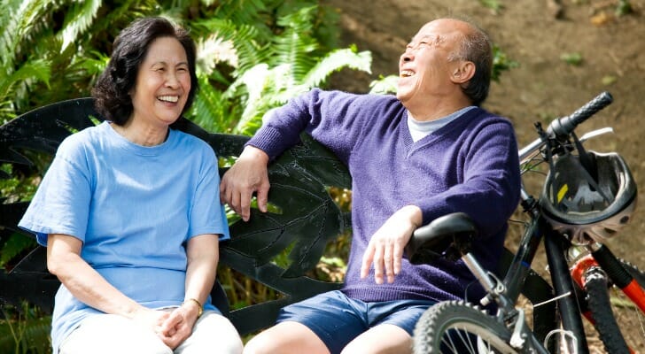 Elderly Asian couple enjoying being outdoors
