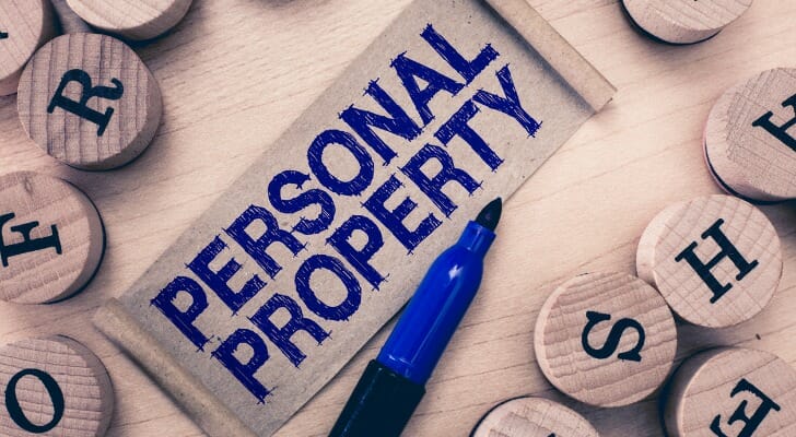 "PERSONAL PROPERTY" written on a piece of wood