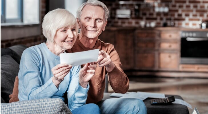 A retired couple looks at a Social Security check one of them received in the mail. The Social Security Expansion Act would increase monthly benefits by $200 and extend the solvency of Social Security by 75 years, its sponsors say.