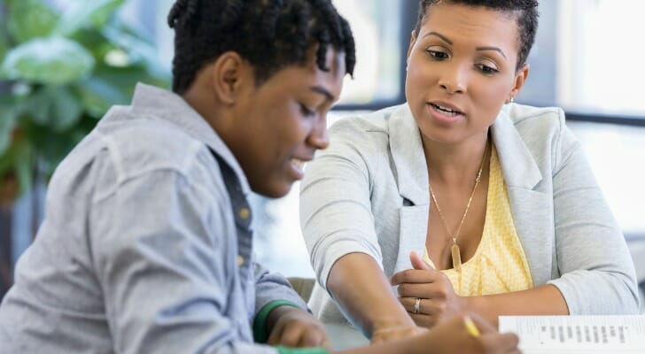 Female financial advisor working with a young client