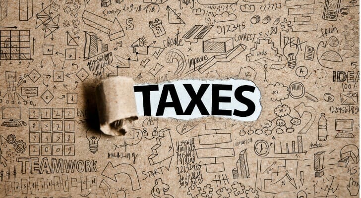 The word "TAXES" on a piece of paper