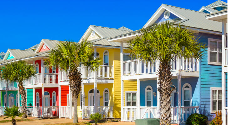 Image shows a row of colorful beachfront properties. SmartAsset analyzed various data points to conduct its latest study on the most affordable beach towns.