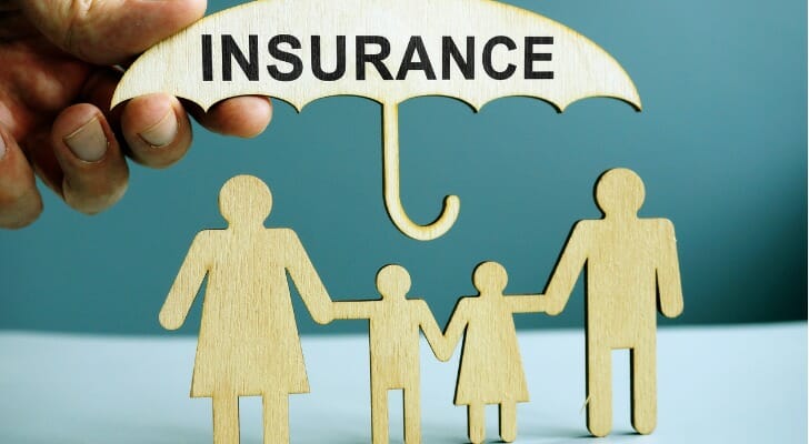 "INSURANCE" umbrella over figures of family members