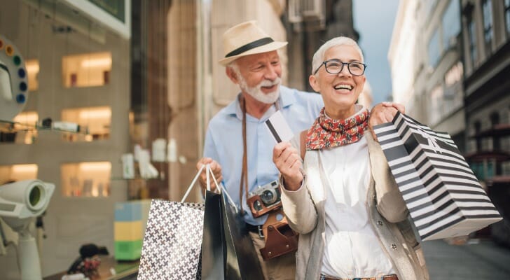 A retired couple shops while on vacation. Researchers at Boston College recently explored the consumption rates of retirees and identified some significant long-term trends.