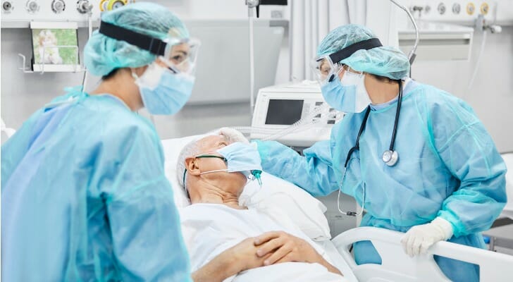 Retired man in a hospital bed