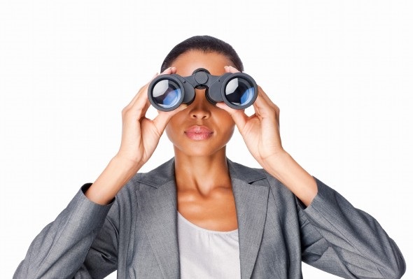 woman looking through binoculars - 401(k) Rollover