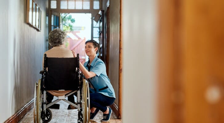 Image shows a woman helping her mother in a wheelchair. The Center for Retirement Research at Boston College found that only a quarter of retirees with severe care needs will be able to afford the services they require.