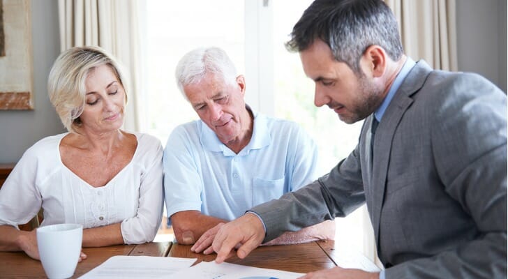 Couple consulting with their pension advisor
