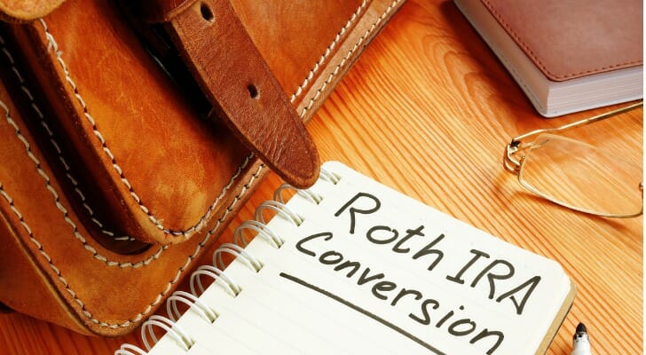 Notebook with "Roth IRA Conversion" written on one of the pages