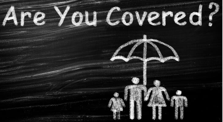 Chalk drawing of a family under an umbrella and "Are You Covered?" written on top.
