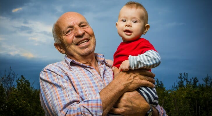 Grandfather holding grandson