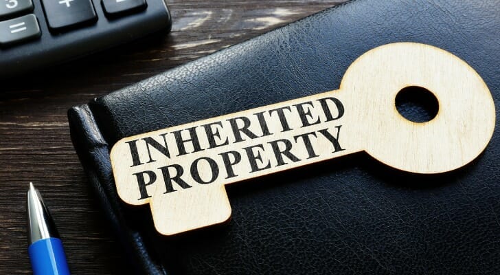"Inherited Property" written on wood