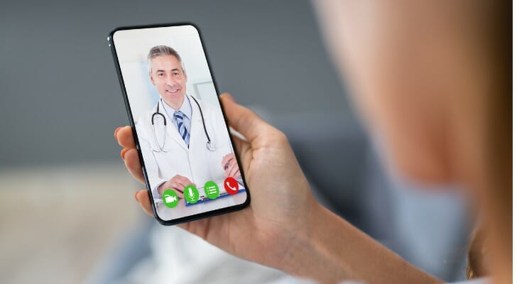 Physician video-chatting with a patient