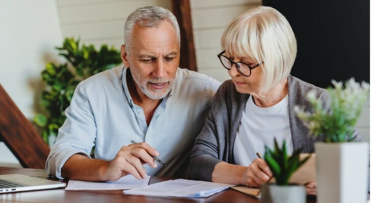 Couple checks their index funds