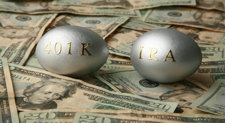 An IRA egg and a 401(k) egg on $20 bills
