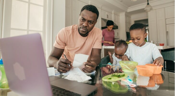 Family man studying his life insurance options