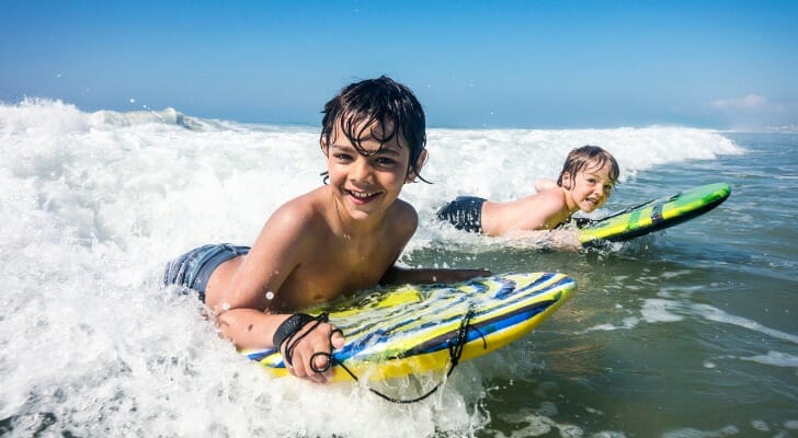 Two boys surfing off the coast of North Carolina