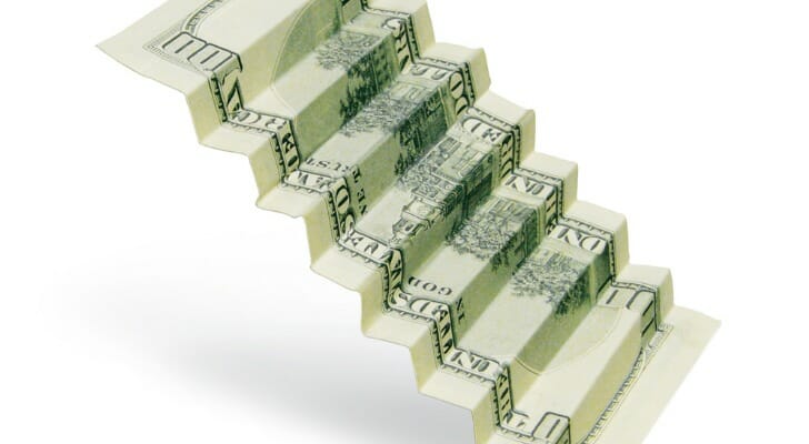 A CD ladder, depicted as a folded U.S. bill, is one way to grow your money. 