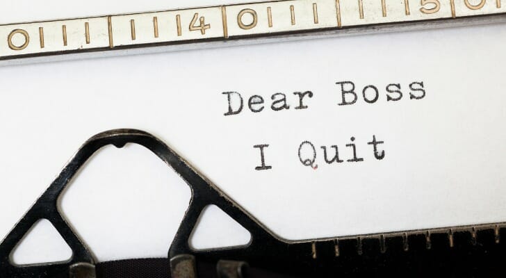 Image shows a note written on a typewriter; it reads, "Dear Boss, I Quit." A record 3.8 million workers quit their jobs in April 2021. SmartAsset breaks down industry quit rates.