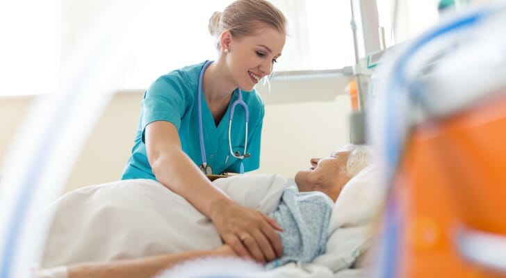 Registered nurse caring for an elderly patient