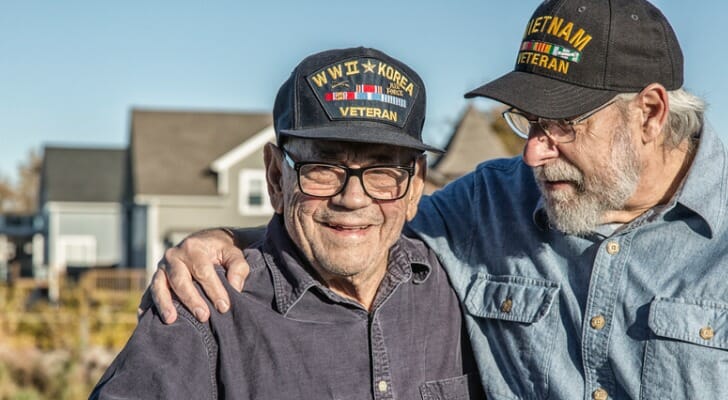 Image shows two U.S. military veterans standing together. SmartAsset analyzed data from various sources to conduct its 2021 Study: Best Cities for Military Retirees.