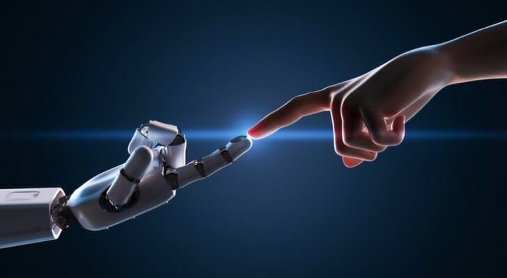 Human and robot touch fingers
