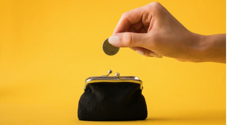 Putting a coin in a purse
