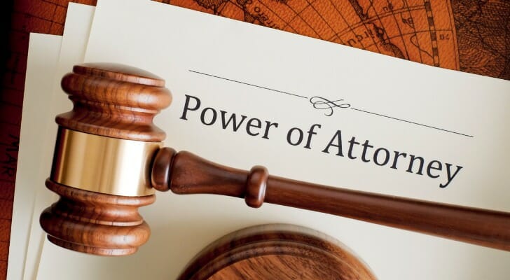 Power of attorney documents and a wooden gavel