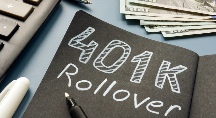 Cash next to a piece of paper that says "401K Rollover"