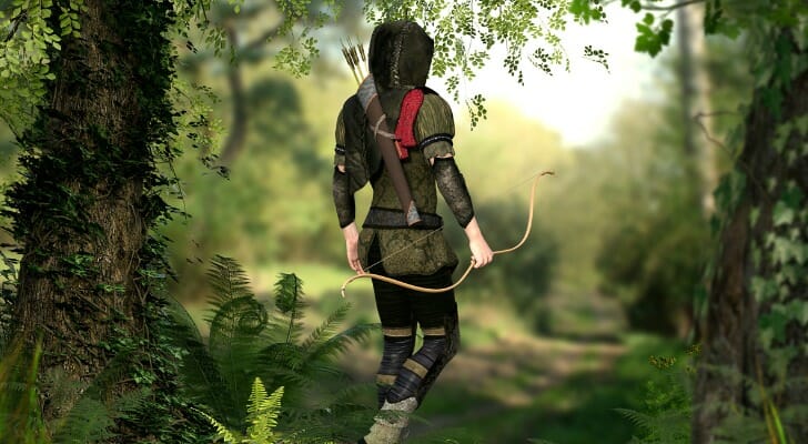 A Robinhood-like person walking through the woods