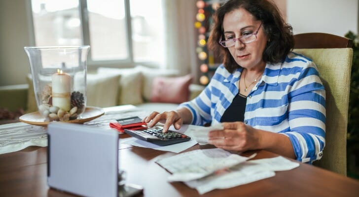 Woman calculating her unified tax credit