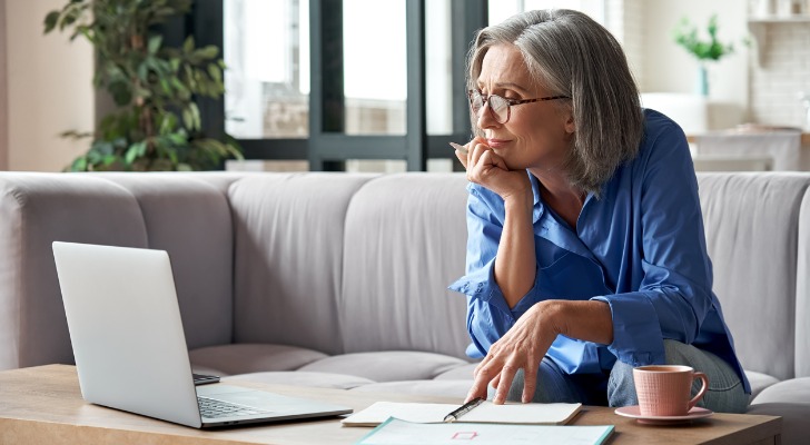 Older woman checks her brokerage account