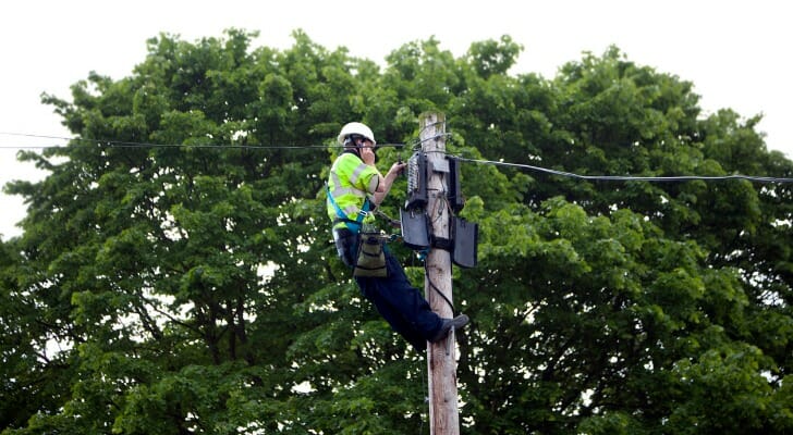 Amid Vermont relief programs, a utility worker at the top of a tree is a welcome sight.