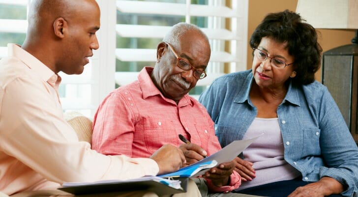 Retired couple working with their lawyer on an estate plan