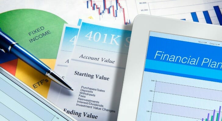 Image shows a variety of financial planning documents, including a financial report and a 401(k) report, all potential information necessary for an interview with a potential financial advisor.