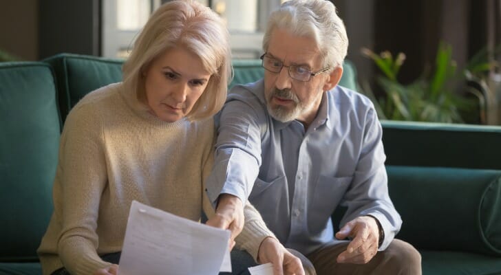 Older couple studying their retirement assets