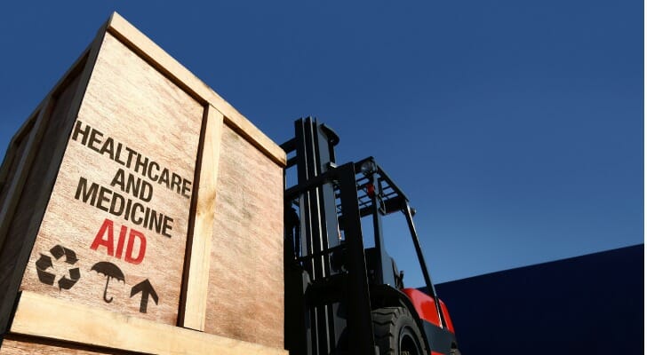 Medical aid in a large container being moved by a forklift