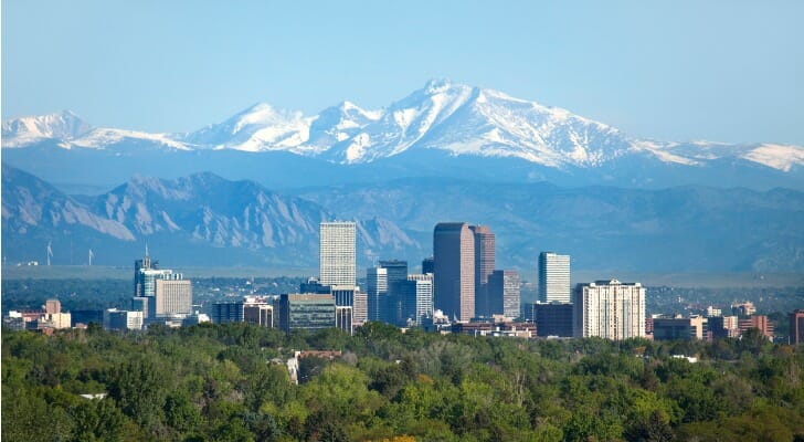 The skyline of Denver, with the Rocky Mountains in the background.