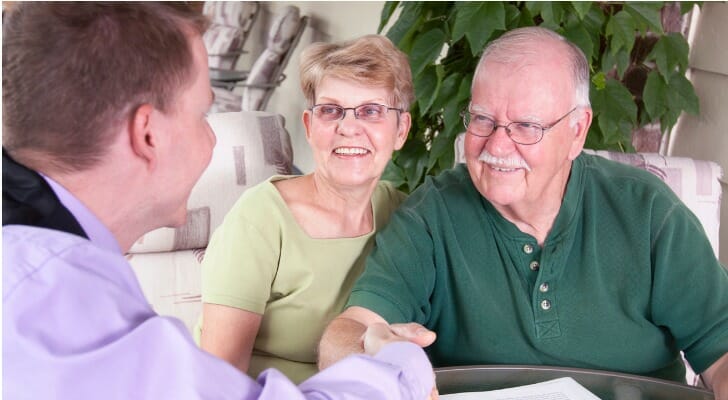 A couple finalizes their estate plan with their attorney