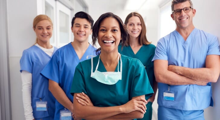 A group of nurses in a hospital hallway