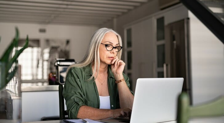 An investor checks how her stocks and bonds are doing