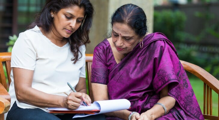 An Indian woman working on her living will with a lawyer
