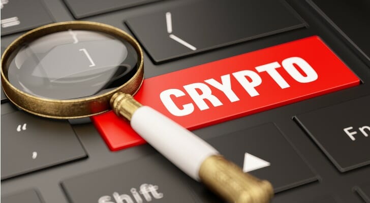 Magnifying glass on a PC keyboard and one key marked "CRYPTO"